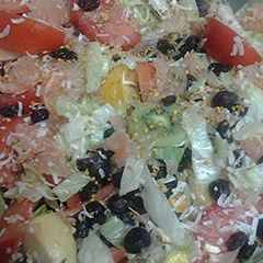 A picture of Fruit nuts and a vegetable salad.