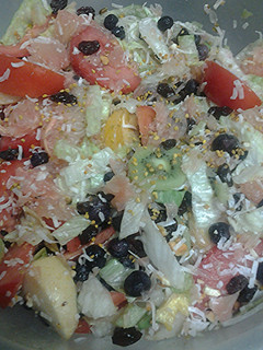 A picture of Fruit nuts and a vegetable salad.