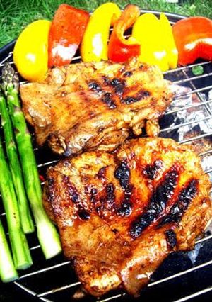 A picture of Jerk Chicken on the Barbecue.