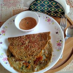 A picture of Crispy Whole Green Gram dal and vegetable chila.