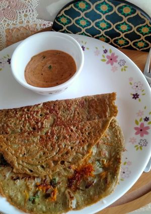 A picture of Crispy Whole Green Gram dal and vegetable chila.