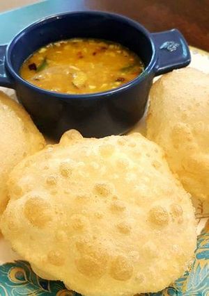 A picture of Puri with chana dal.