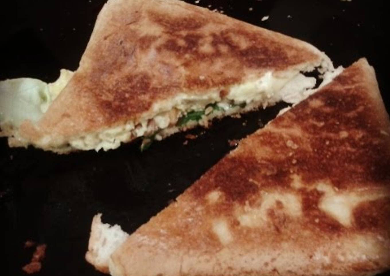 Sandwich with fried cheese and eggs