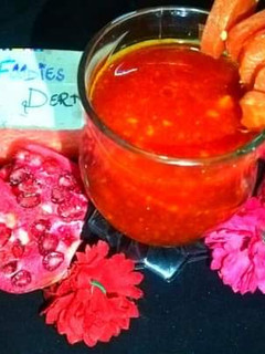A picture of Red carrot n pomegranate juice.
