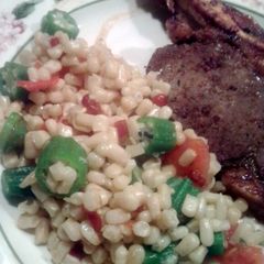 A picture of Corn, okra and tomatoes.