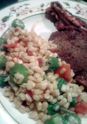 A picture of Corn, okra and tomatoes.