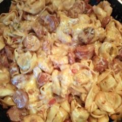 A picture of One pot Tortellini in a creamy tomato sauce.