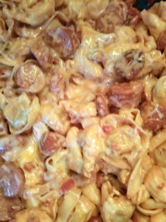 A picture of One pot Tortellini in a creamy tomato sauce.