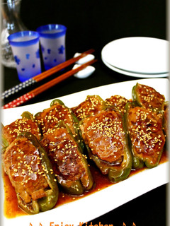A picture of Stuffed Bell Peppers with Thick Sweet and Sour Sauce.