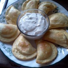 A picture of Fried Pierogies w/ Sour Cream n Chives.