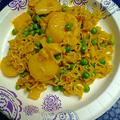 A picture of Golden Potatoes, peas, and ramen.