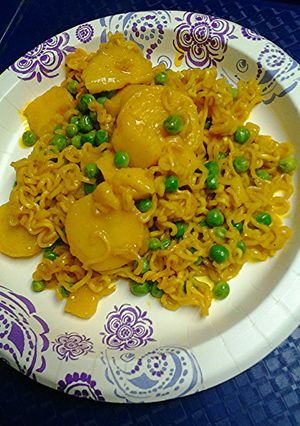 A picture of Golden Potatoes, peas, and ramen.