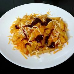 My Two Cheese Melted over Chips & BBQ Sauce A picture of My Two Cheese Melted over Chips & BBQ Sauce.