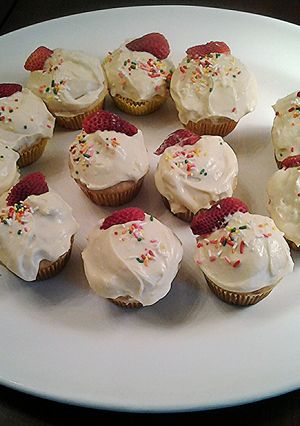 A picture of Honey/Lemon/Ricotta Cupcakes with Lemon Cream Cheese Frosting.