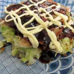 A picture of Okonomiyaki with Lots of Cabbage.