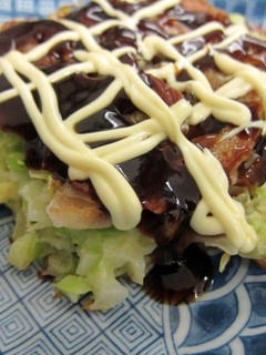 A picture of Okonomiyaki with Lots of Cabbage.