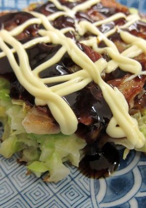 A picture of Okonomiyaki with Lots of Cabbage.