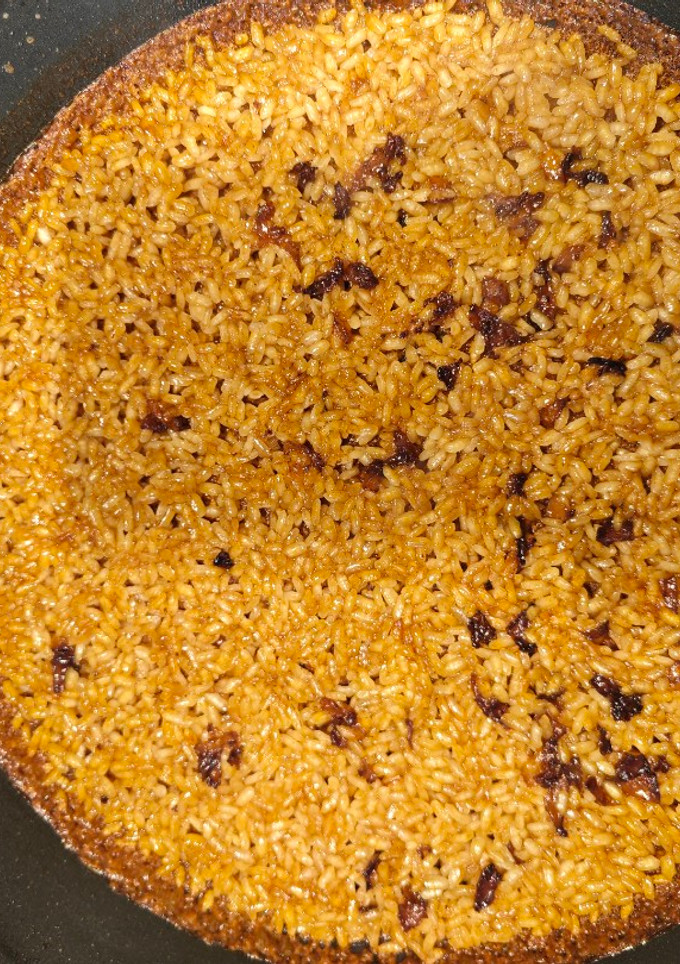 Una foto de Arroz con caldo de manitas