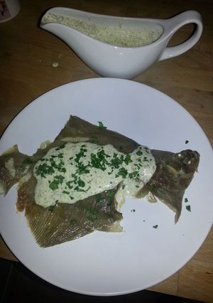 A picture of MZ-Whole plaice with lemon butter sauce.