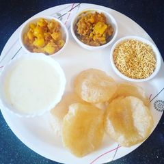 A picture of Milk custard and potato sabji and namkin.