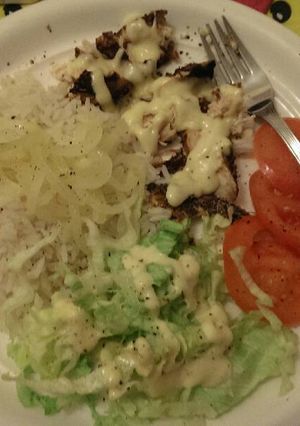 A picture of Grilled chicken rice and salad.