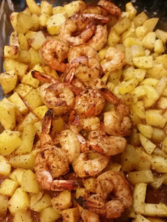 A picture of Steak house shrimp and potatoes.