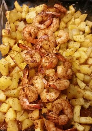 A picture of Steak house shrimp and potatoes.