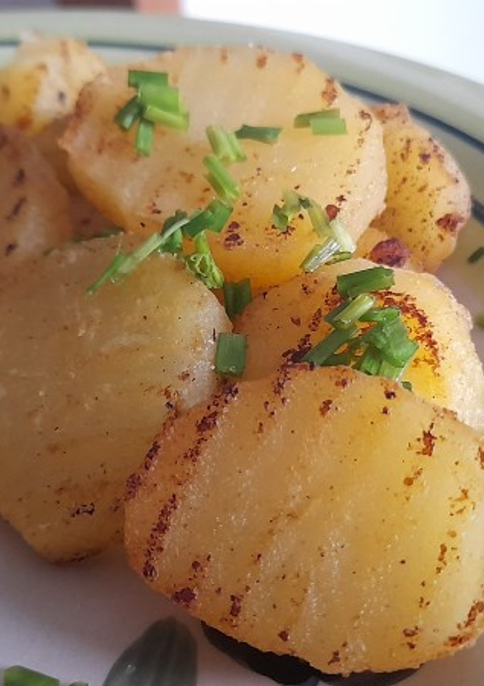 Una foto de Papas salteadas al limón