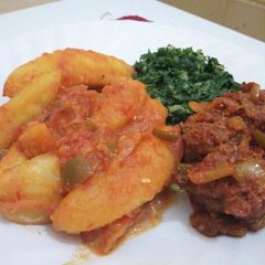 A picture of Matoke(Plantain) Served With Meatballs and Creamed Spinach.