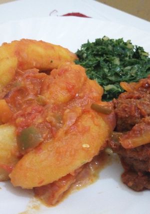 A picture of Matoke(Plantain) Served With Meatballs and Creamed Spinach.