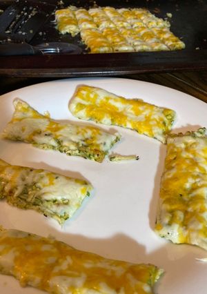 A picture of Cheesy zucchini sticks.