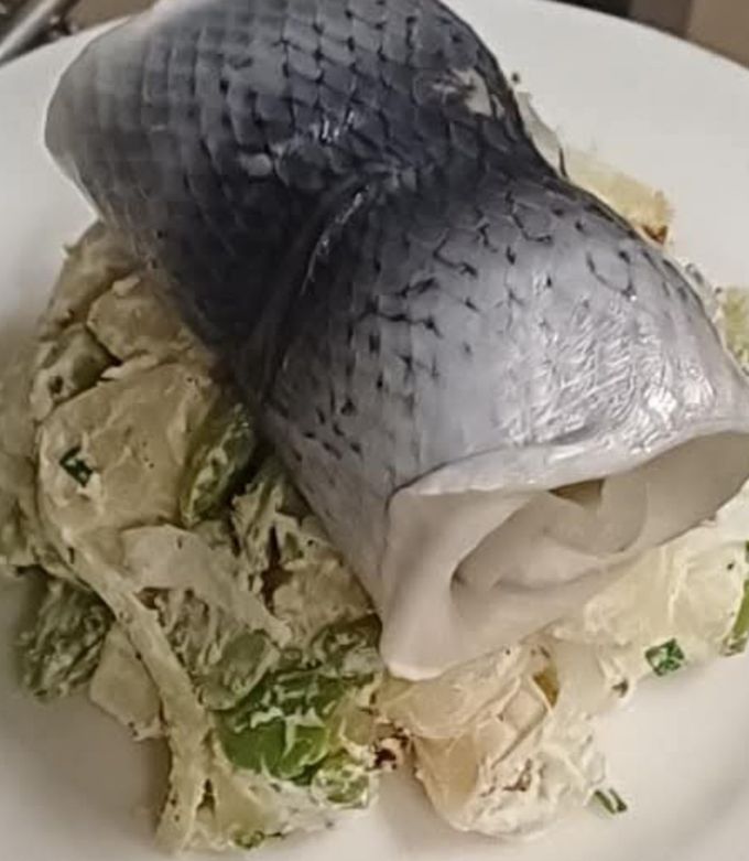 Une photo de Salade de pommes de terre aux hareng fume
