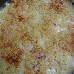 A picture of Hotdogs with rice casserole.