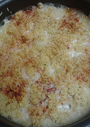 A picture of Hotdogs with rice casserole.