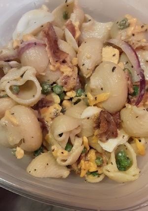 A picture of Bacon Pea Creamy Pasta Salad with lemon parmesan dressing.