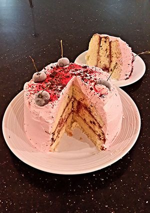 A picture of Vanilla Chip Layer Cake with Cherry Curd Filling.