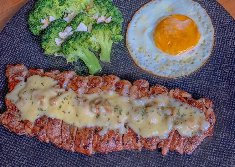 Grilled beef steak with mozzarella