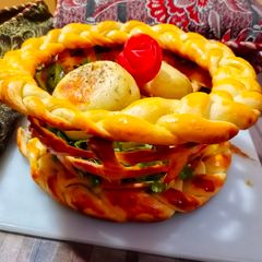 A picture of Bread Basket With Chicken Cheese kabab Buns.