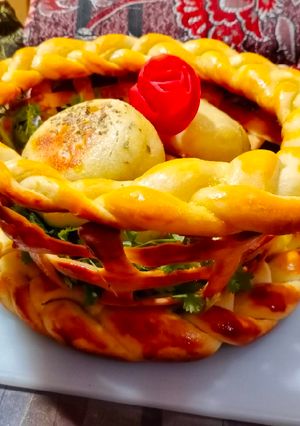 A picture of Bread Basket With Chicken Cheese kabab Buns.
