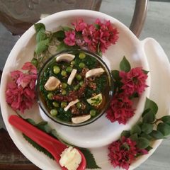 A picture of Sarson ka sag with green pease & mushroom.