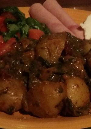 Una foto de Papas con espinacas