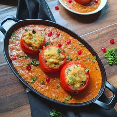 A picture of Stuffed Cheesy Tomato in Creamy Gravy.