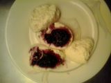 Rasbaris (milk balls) with cherry sauce