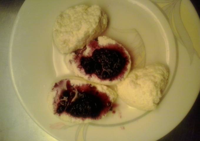 Rasbaris (milk balls) with cherry sauce
