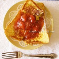 A picture of Alluring French Toast Topped with Strawberry Sauce.
