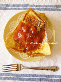 A picture of Alluring French Toast Topped with Strawberry Sauce.