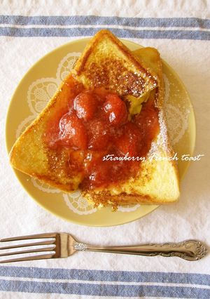 A picture of Alluring French Toast Topped with Strawberry Sauce.