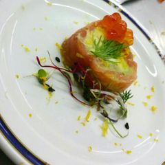 A picture of Salmon garvlax with guacamole.