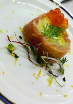 A picture of Salmon garvlax with guacamole.