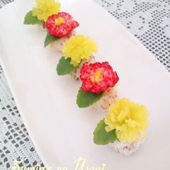 A picture of Radish Dandelion Sushi Balls For Doll Festival or Mother's Day.